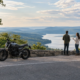 Motorcycle and two people at an Arkansas roadside, illustrating multiple claimants and insurance limits
