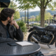 Bentonville motorcycle accident recorded statement: rider considers an insurer call beside a parked motorcycle